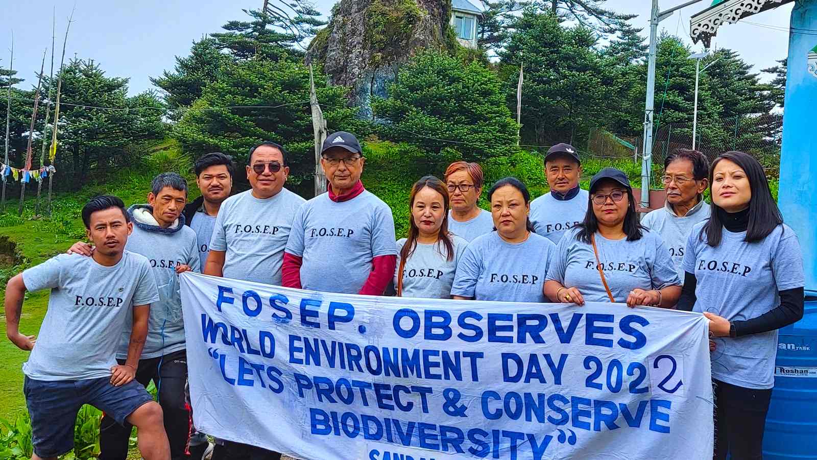 FOSEP members holding a World Environment Day 2022 banner at Sandakphu
